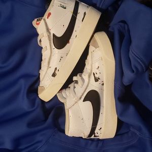 Nike Blazer mid., size 9c, white with black swoosh and splatter paint.